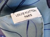 a close up of a label on a blue and purple shirt