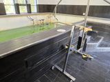 a large bathtub with a green tub in the middle of the room