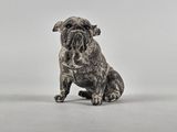 figurine représentant un chien assis sur ses pattes arrière