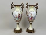 pair of antique vases with hand painted scenes on them