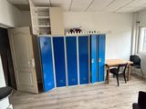 an image of a room with blue lockers in it