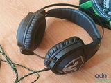 a pair of headphones sitting on a table next to a camera
