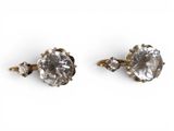 an image of a pair of diamond earrings on a white background