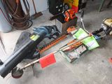 a picture of a chainsaw and other tools in a garage