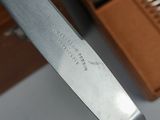 a knife that is sitting on top of a knife holder