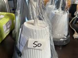 two cups that have been wrapped in plastic on a table