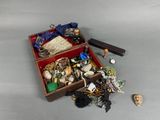 a wooden box filled with assorted items on a table