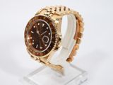 an image of a rolex watch with a brown dial on a gold bracelet