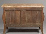 an old wooden chest with a marble top on a grey background