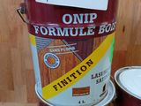 several cans of paint are stacked on top of each other