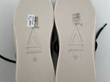 the soles of a pair of shoes are shown on a white surface