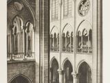 a black and white photo of a church with a clock on the wall
