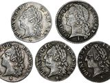 quatre pièces romaines, dont l'une représente un buste et l'autre est un buste