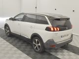 a picture of a white car parked in a garage