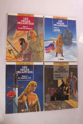 trois livres posés sur un mur blanc, avec une photo d'une femme et d'un homme