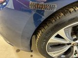 a blue car with a sticker that says veauuto on it