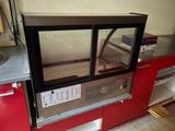 a microwave that is sitting on a counter in a kitchen