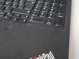 the back of a black laptop with a thinkpad logo on it