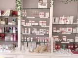 a display of cosmetics products on a shelf in a store