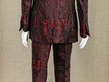 an image of a mannequin dressed in a red and black suit