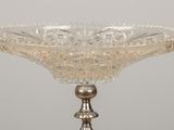 an image of a glass bowl on a stand on a table