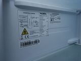 an image of a white refrigerator with labels on it