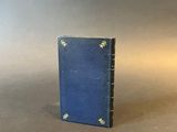 a small blue book with stars on it sitting on a table
