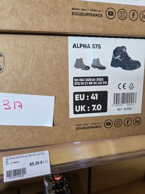 two boxes of shoes on the shelf in the store