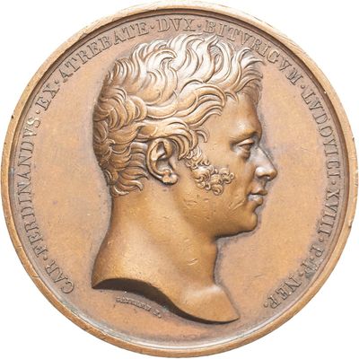 l'image d'une médaille de bronze sur laquelle figure le visage d'un homme