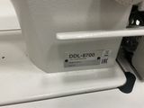 a close up of a sewing machine on a table