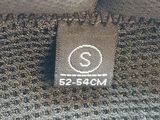 the label of a sweater is shown on the bottom of the sweater