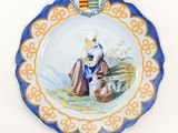 an image of a plate with a picture of a woman sitting on a bench