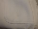 a close up of a white bag on a table
