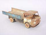 a toy truck that is sitting on a white surface