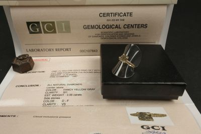 a certificate and a pair of glasses sitting on a table