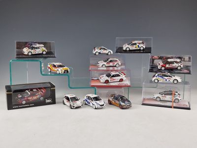 a lot of different model cars on display in a case