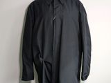 a close up of a black coat on a mannequin mannequin