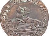 a close up of a coin with a horse and rider on it