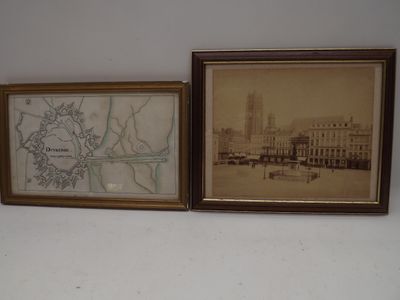 two framed pictures on the wall of a room