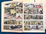 two pages of comics are open on a blue surface