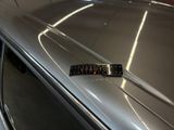 a close up of a car with a sticker on the hood