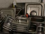 many pans and pans on the counter in the kitchen