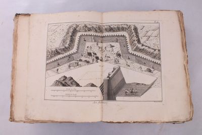 un livre ouvert sur lequel est dessiné un château