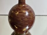 a vase that is sitting on a glass table