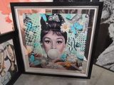 a picture of a picture of a woman blowing a bubble