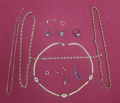 a lot of jewelry that is laying out on a table
