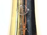 a close up of a gold trumpet on a white background