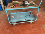a blue cart with tools on it in a garage