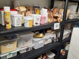 a shelf full of food and containers in a room