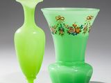 two vases sitting next to each other on a table